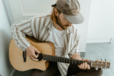 A person playing on guitar