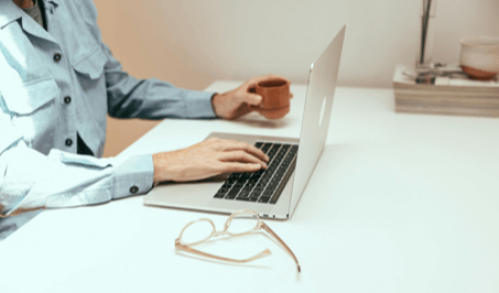 A person typing on a computer