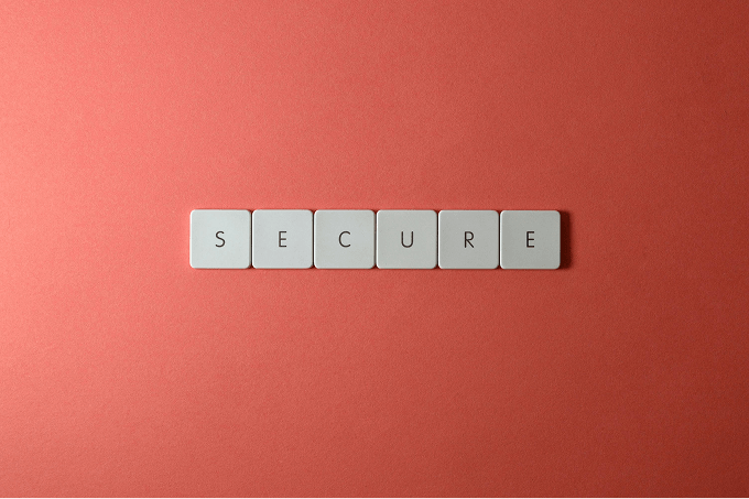 Word secure on orange background