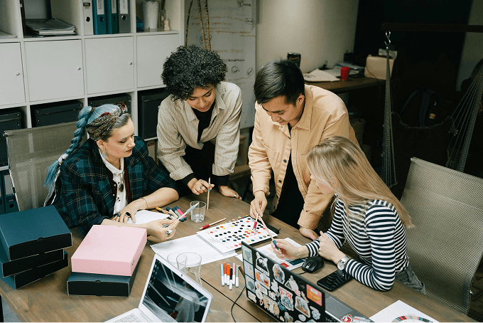 Team of four collaborating in an office