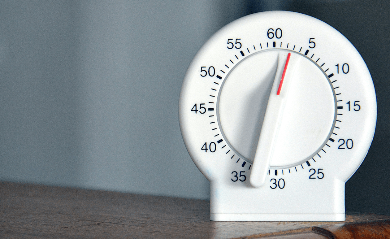 A white timer on a table