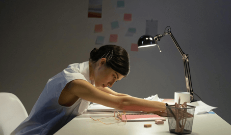 Person stretching at a desk