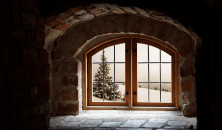 A window with snowy weather outside
