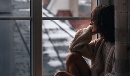 A woman looking out the window