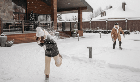 A couple playing in snow